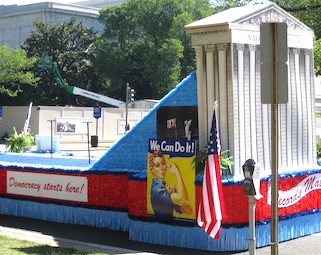 Democracy float decorated with American flag and white house