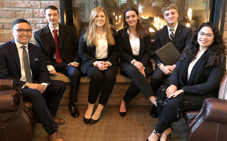 Moot Court team in Colorado posing in their suits